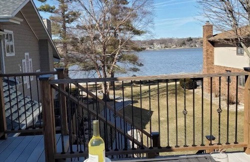 Rapids City House | Luxury river front two-bedroom carriage house with private deck and hot tub.