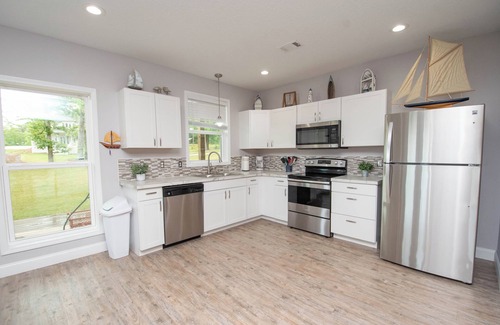 Dadeville House | Majestic Lakefront Home Awesome boathouse, Sandy beach, Decks, Amenities galore!
