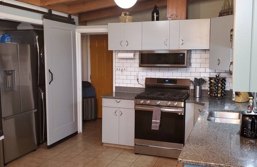 Norton Shores House | Mid Century Modern home 2 minutes from the beach and trails close to everything!