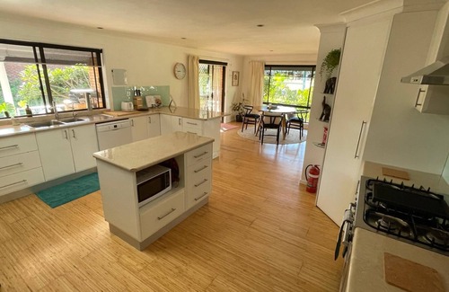 Arrawarra Headland House | Minutes walk to stunning Mullaway beach. Huge house with swinging veranda chair.