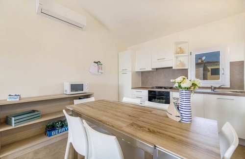 Monte Petrosu Apartment | modern apartment 5 min. from the sea with swimming pool, air conditioning and wi-fi