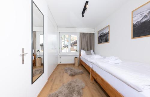 Champfer Apartment | Modern crossing apartment facing Piz Rosatsch