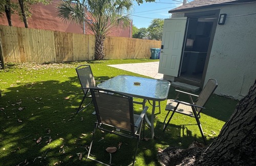 Liberty City House | Modern home with driveway parking and fenced yard.