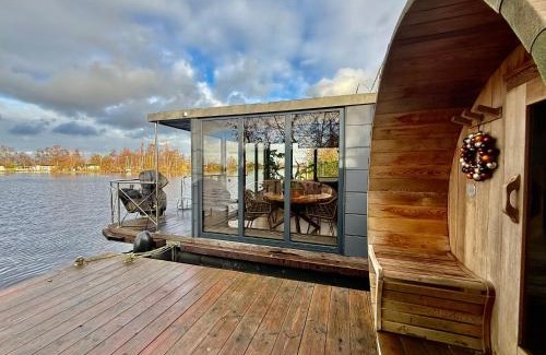 Baambrugse Zuwe Boat Rental | NEW - Little Asia - Stunning Boathouse on a lake Near Amsterdam with Sauna