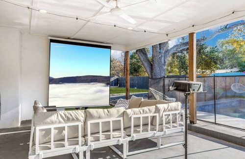 Castle Hills House | New! Sleeps 16! Heated Pool, Outdoor Movie Theater, Game Room, Putting Green!