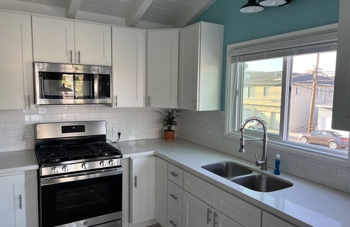 Peninsula Apartment | Newly remodeled beach cottage steps to the sand with Ocean view. New everything!