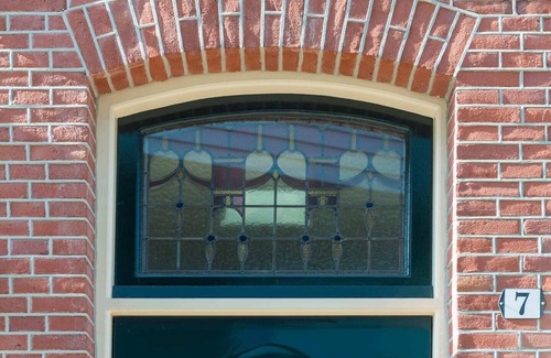 Centrum Apartment | Newly renovated 1920 building with large hotel bed, patio and shared kitchen.
