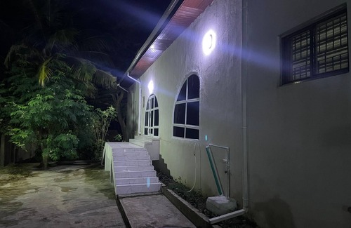 Abeokuta House | Newly renovated almost heaven 2 bdrm; large living room with view of courtyard.