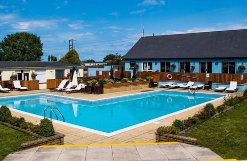 Llanllwchaiarn Cabin | NEWQUAY WALES sleeps 6 people at ocean heights site.with heated pools also bars.
