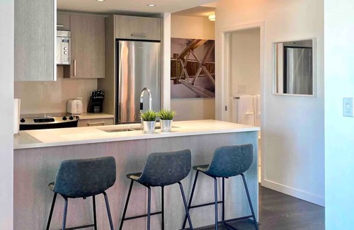 Downtown Eastside Condo | Panoramic views from modern condo +office