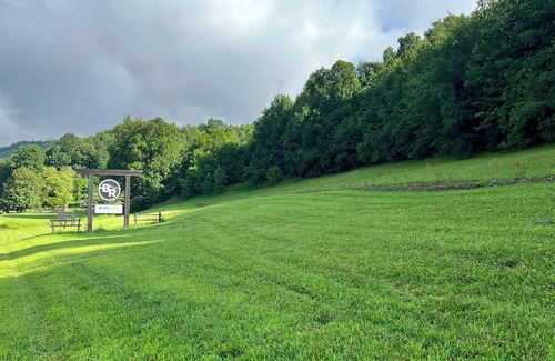 Ferguson RV Rental | Panoramic views of Blue Ridge Mountains, large RV elec & water sites pondside