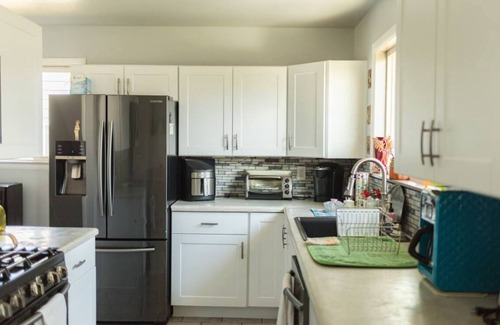 Billings House | Pet Friendly Family Getaway- Fitness Room & Backyard