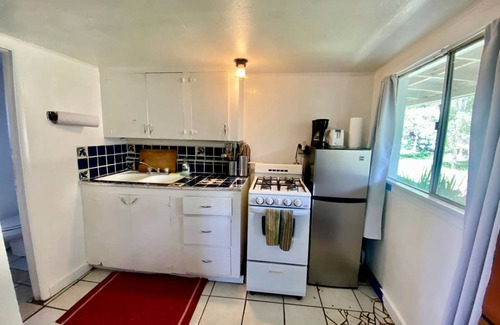 San Cristobal House | Petite Log Cabin on Organic Farm in New Mexico