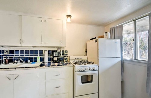 San Cristobal House | Petite Log Cabin on Organic Farm in New Mexico