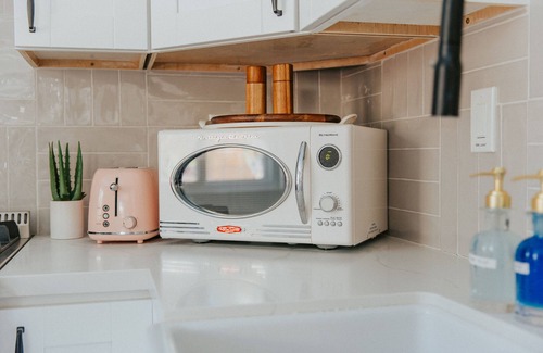 Fire Mountain House | Pink Paradise Inn - 5 BR Fun Retro Home w/Pool