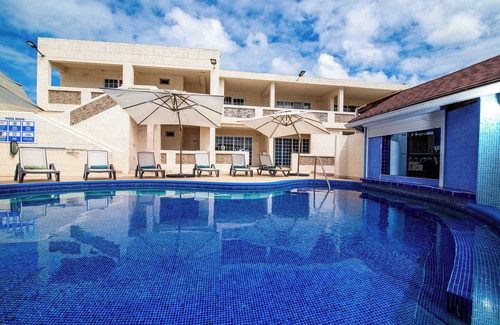 St. Lawrence Gap Apartment | Poolside Studio, Shared Patio and Hotel Amenities