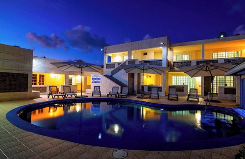 St. Lawrence Gap Apartment | Poolside Studio, Shared Patio and Hotel Amenities