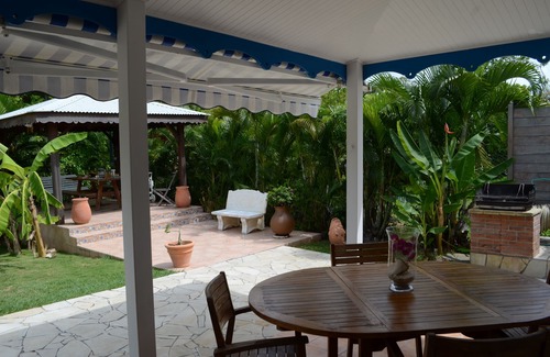 Sainte-Anne Villa | Pretty, old Creole villa with veranda, gazebo and floral garden.
