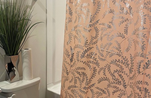 Milford House | Primary bedroom and private bathroom space. Shared kitchen and dining area