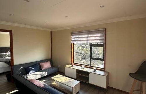 Lanseria Apartment | Quaint Log Cabin