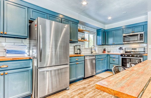 Three Rivers House | Quaint, riverfront home with woodstove, patio, deck, board games & washer/dryer