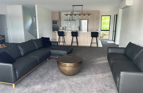 Raglan House | Rangitahi paradise. A modern 4 bedroom home overlooking the estuary in Raglan.