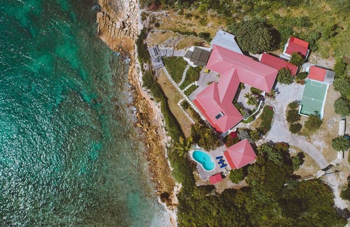 Freetown Villa | Raw And Rustic Waterfront Retreat. One Of A Kind Home In A Unique Location