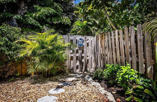 Ilexhurst Cottage | Relax and Tan on Your Private Patio. Just a minute to the beach