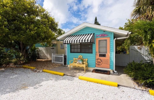 Ilexhurst Cottage | Relax and Tan on Your Private Patio. Just a minute to the beach