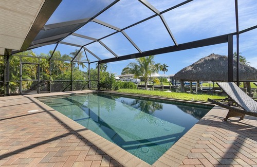 Eight Lakes House | Relax in Style: 3BR/2BA Retreat, Pool & Tiki Hut