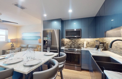 Sunset Beach Condo | Renovated Sunset Beach Waterfront Condo with Water Views, Pool, Fishing Dock & Beach Access.