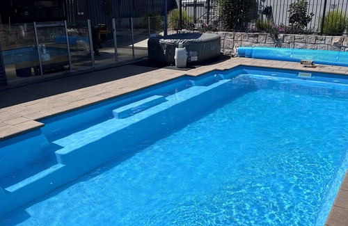 Hughes House | Resort style home pool spa sauna