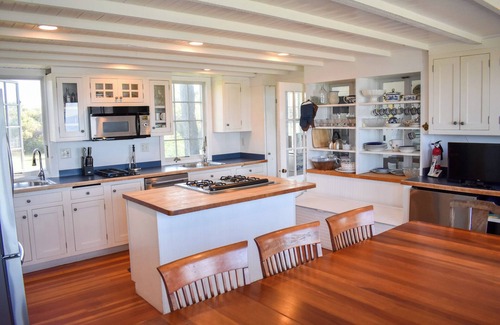 Dennis House | Rustic Oceanfront Retreat with Private Beach and Expansive Deck