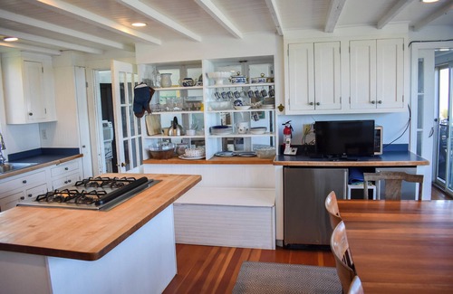 Dennis House | Rustic Oceanfront Retreat with Private Beach and Expansive Deck