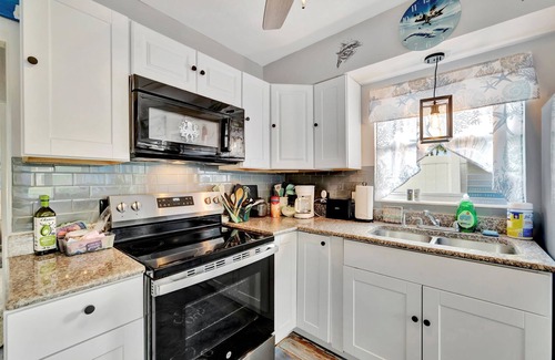 Treasure Island Apartment | Seashell Suite 1B Pet Friendly Waterfront Dock