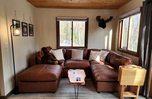 Paris House | Secluded Luxury Cabin with Hot Tub on 10 Private Acres near Trails in Reed City, Michigan