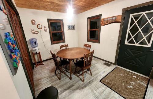 Paris House | Secluded Luxury Cabin with Hot Tub on 10 Private Acres near Trails in Reed City, Michigan