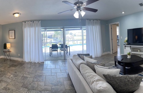 Eight Lakes House | Short Distance From Tarpon Point Marina! Gulf Access, Heated Pool, Dock & Tiki!
