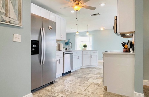 Eight Lakes House | Short Distance From Tarpon Point Marina! Gulf Access, Heated Pool, Dock & Tiki!