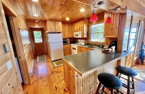 Harrison Cottage | SLEEPS 15 WITH A PRIVATE SANDY BEACH ON LONG LAKE.