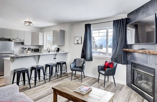 Harvie Heights Condo | Spa Serenity, BBQ Fun, Scenic Mountain Views