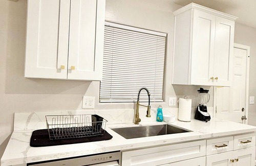 Baker Street House | Spacious 4-bedroom house in charming Bakersfield with AC. 4 queen & 3 twin beds.