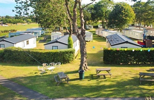 Sandown House | Spacious modern caravan with one double and two twin.