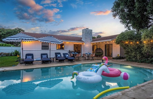 Lake Clarke Shores House | Spacious Palm Beach Paradise with Heated Pool and Backyard Games