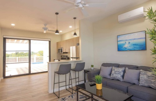 Leeward Settlement Apartment | Stay in a Long Bay Beach Villa with a Shared Pool