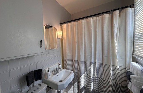 Sheridan House | "Steps from downtown and the park, this cozy mid-century hideaway offers comfort, charm, and a private outdoor escape."