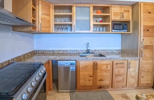 La Paz Condo | Steps from the Beach: Pool, Gym & Tennis Court