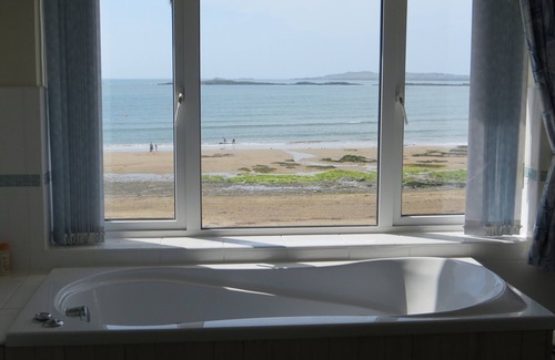 Rhosneigr House | Stunning bay views and sunsets seen from all main rooms. Games room. Wetroom.