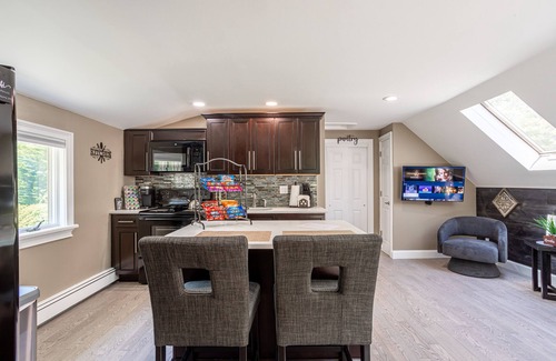 Huntington Station Apartment | Stylish Upscale Apt w/Snack Bar & Sunny Deck