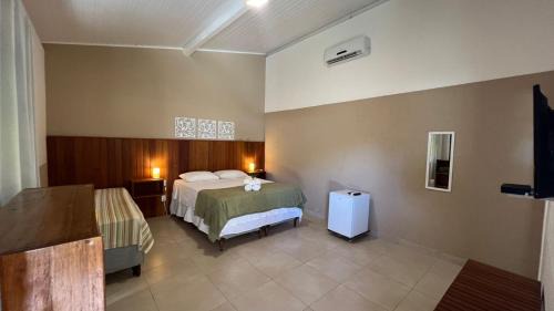 Cumuruxatiba House | Suítes Curió - Passarim Hospedagem